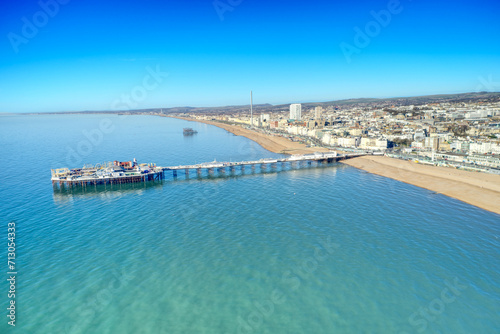 Aerial view of the Victorian Palace Pier in Brighton, a popular attraction at this popular resort City in East Sussex, England.