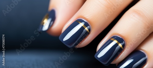 Navy blue nail polish manicure on woman s hand, beauty salon, nail art, french manicure