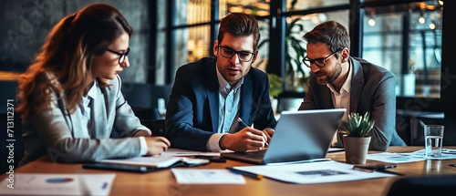 Business consulting, collaboration, business people in suits working in an office, sitting at a table, using mobile devices, talking about analytics, diagrams, charts. Teamwork concept.