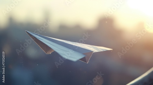 A paper airplane soars through the sky above a bustling city. This image can be used to represent dreams, freedom, adventure, or travel