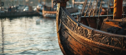 figurehead on the bow of a full scale replica of a viking ship moored in port. Copy space image. Place for adding text