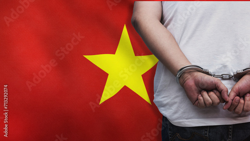 A man getting under arrest in Vietnam. Concept of being handcuffed, detained, incarcerated and jailed in said country. National law enforcement concept.