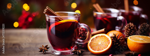 a glass of mulled wine on a wooden table. Christmas concept