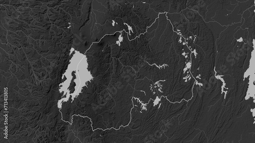 Rwanda outlined. Grayscale elevation map