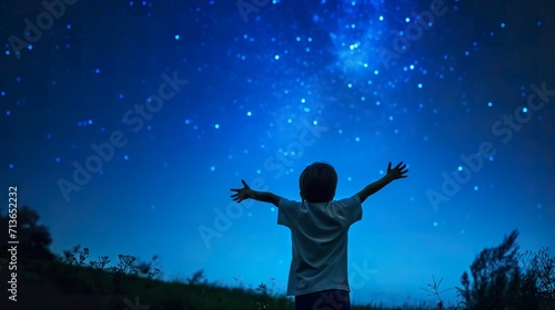 Child observes the stars and constellations in the night sky, beautiful and aspirational. natural background.