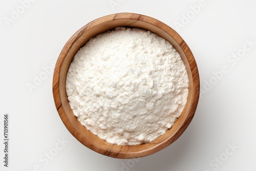 Top view of rice flour in wooden bowl with rice ears isolated on white background