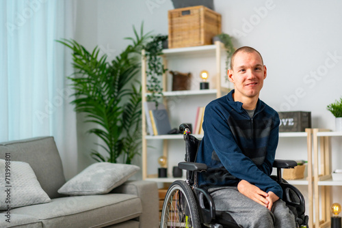 Portrait of a cheerful disabled man chilling at home