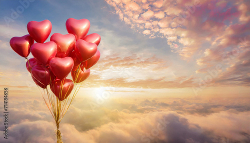 Red balloons shape heart in the sky in clouds in the sunset bright light.