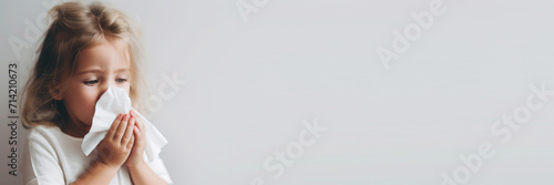 A young girl is suffering from dust allergy, banner