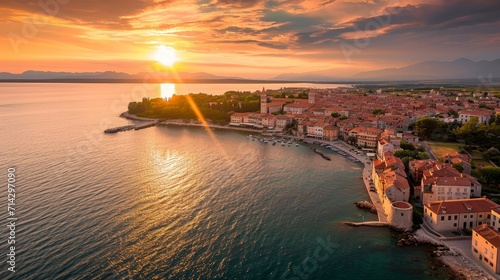 Aerial view of Porec at sunset, a small town along the Adriatic Sea coastline in Istria, Croatia. 