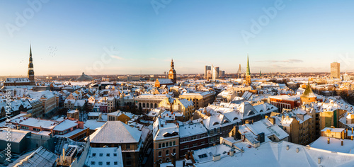 Aerial panorama view of Riga old town during beautiful winter day in Latvia. Freezing temperature in Latvia. White Riga.