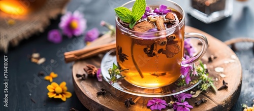 Cinnamon-infused herbal tea with edible flowers.