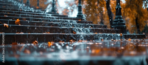 Blurred rain splashing on stairs in Belgrade during a rainy autumn afternoon.