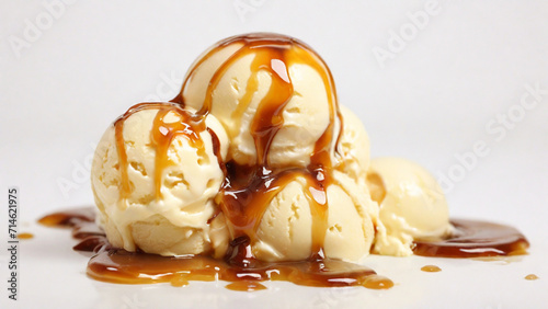 vanilla ice cream with melted caramel sauce isolated on a white background