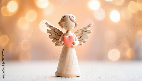 Cute wood angel with heart and copy space