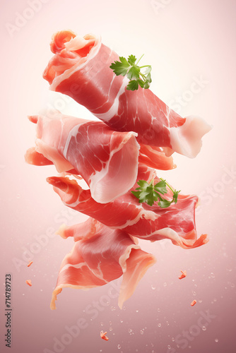 Delicate slices of prosciutto with fresh parsley leaves tumble gently, displayed on a sofy pink background. 