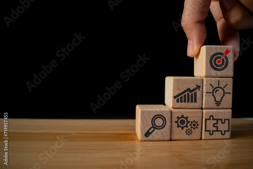 Business goal, plan. wooden cubes with icon business strategies, action plan, goal, process, game plan, Business strategies and achieving goals, Business challenge, wooden cube, pyramid wooden cubes.