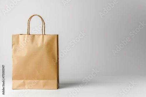A paper grocery bag on a light gray background, with an empty space