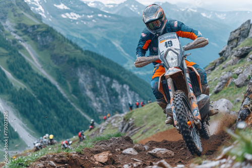 An equipped motorcyclist makes a race in a mountainous landscape. The concept of motorsport