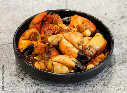 gang muoi stir fried crab claws, cangcum sotme,chay toi served in dish isolated on grey background top view of singapore seafood