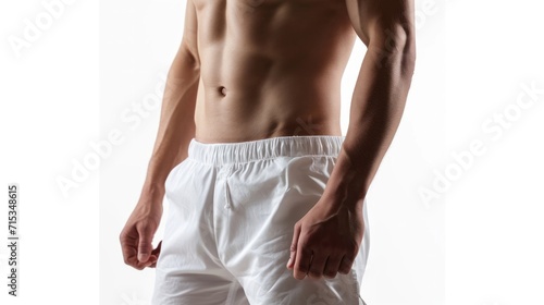 Slim man with six pack and white shorts on white background. shot of the model waist. Slim body with cellulite or healthy, fit, muscular, underwear, guy, attractive