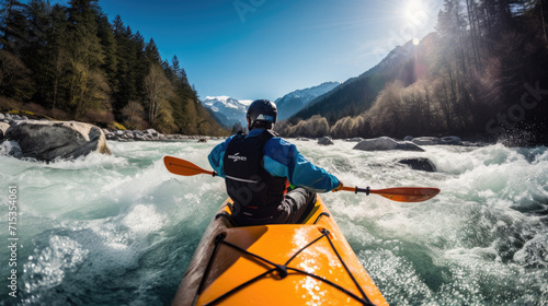 whitewater kayaking, down a white water rapid river in the mountains 