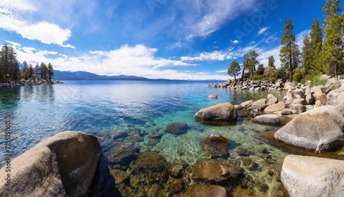 lake tahoe rocky shoreline in sunny day beach with blue sky over clear transparent water