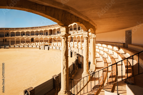 Plaza de Toros (Bullring) in Ronda, Spain. A popular and historic bullring known for its elegant neo-classical architecture featuring a double order of lowered arches.