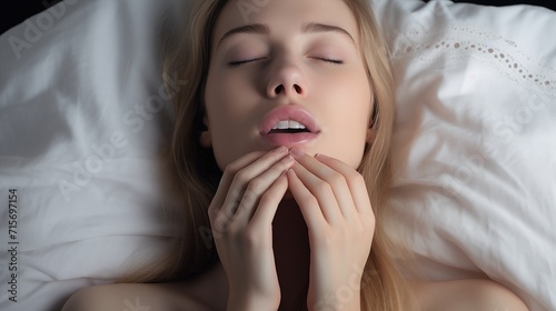 woman having orgasm in bed