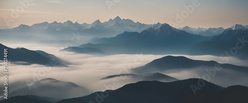  Serene Mountain Range, a panoramic view of a majestic mountain range with peaks shrouded in mist