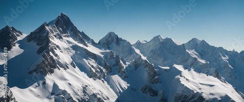 Snow-Capped Mountain Peaks, majestic snow-capped mountains under a clear blue sky, embodying 