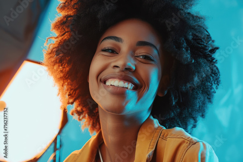 Afro young woman content creator cheerful with working in the studio