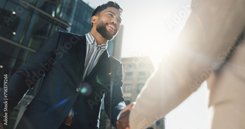 Outdoor, business people and men with handshake, greeting and contract with corporate, New York and smile. Staff, employees in a city and coworkers with hello, partnership and buildings with friends