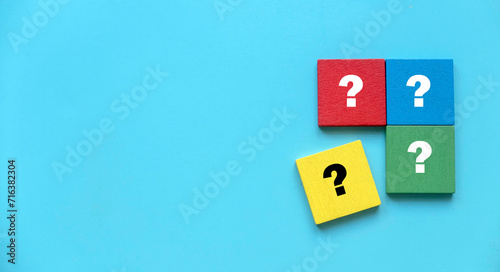 Q&A or questions and answers concept.Multicolor square puzzle with a symbol of question mark. Copy space.