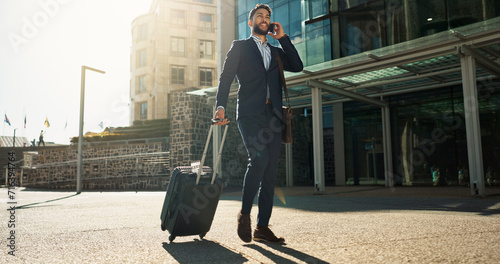 Business man, suitcase and phone call in city for professional communication, transport and travel news or information. Happy corporate worker with mobile chat, luggage and walking outdoor to airport