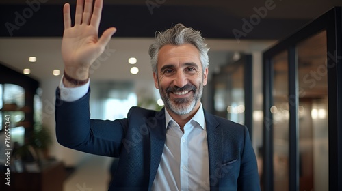 Young employee with a welcoming gesture in the office , Young employee, welcoming gesture, office