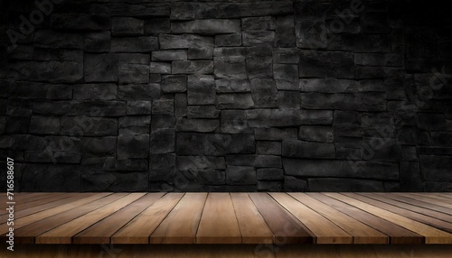 wooden table or counter top with black stone wall background
