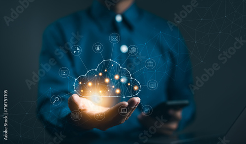Cloud computing technology concept. Businessman hand holding cloud computing icon network. download and information upload on application system. data transfer loading solution, Secure online storage,
