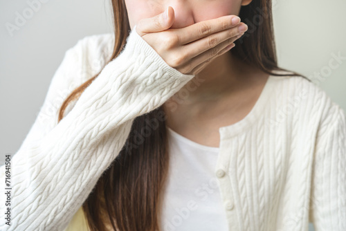 Unhappy pregnant asian young woman, pain girl suffering from nausea, having vomit feeling sick, hand covering mouth, having problem throwing up, puke from food poisoning, lady with morning sickness.