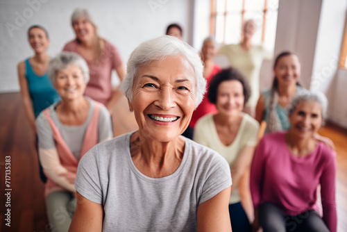 Smiling group of senior women in an exercise class, enjoying an active and healthy lifestyle.