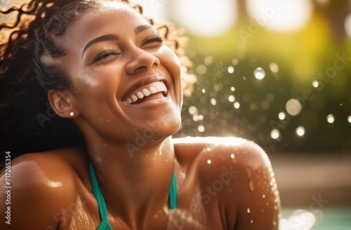 summertime leisure, sunbathing in pool in bikini. sexy black woman laughing, enjoying vacation
