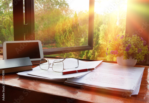 red pen over blurred paperwork for proofreading