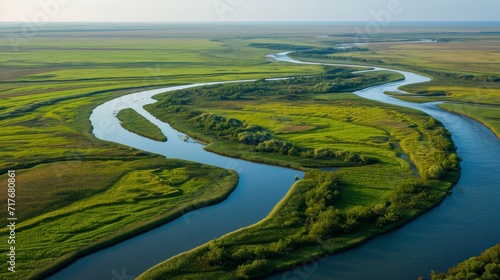 Aerial view of a large, winding river delta background.
