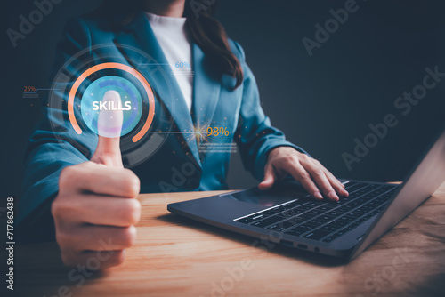Skill levels growth. Increasing Skill Level. Businesswoman hand is press to the maximum position progress bar with the word SKILLS. Professional, educational knowledge, human resources concept.