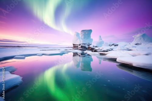 arctic sea reflecting a purple aurora during winter