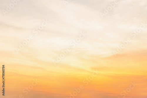 Vibrant Sunset Painting the Sky with Shades of Orange and Red, Illuminating Clouds in a Beautiful Evening Landscape