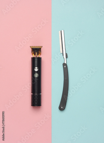 Modern trimmer and straight razor on blue pink background