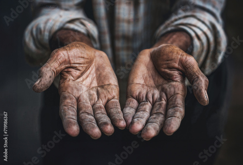 Homeless man with his hands out for donations