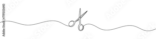 Continuous scissors with one line on a white background.