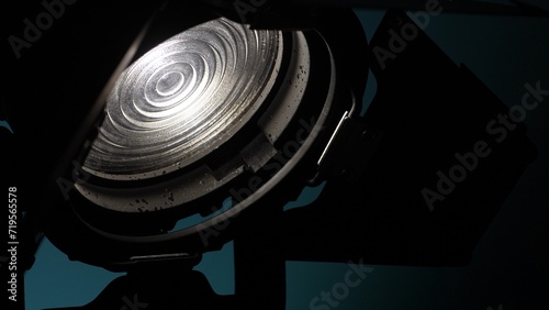 Close-up Studio light with fresnel lens and barndoors.